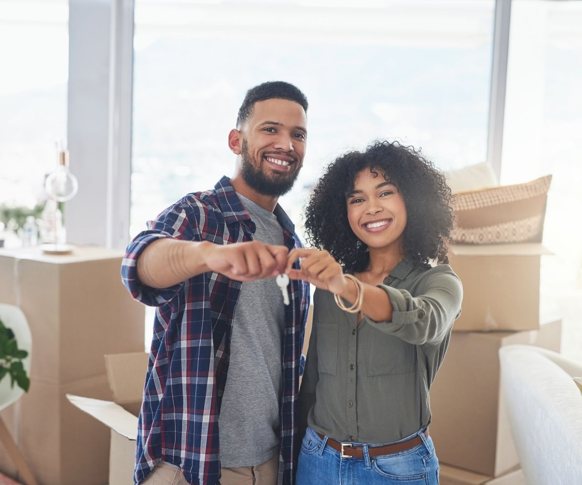 Couple holding house keys