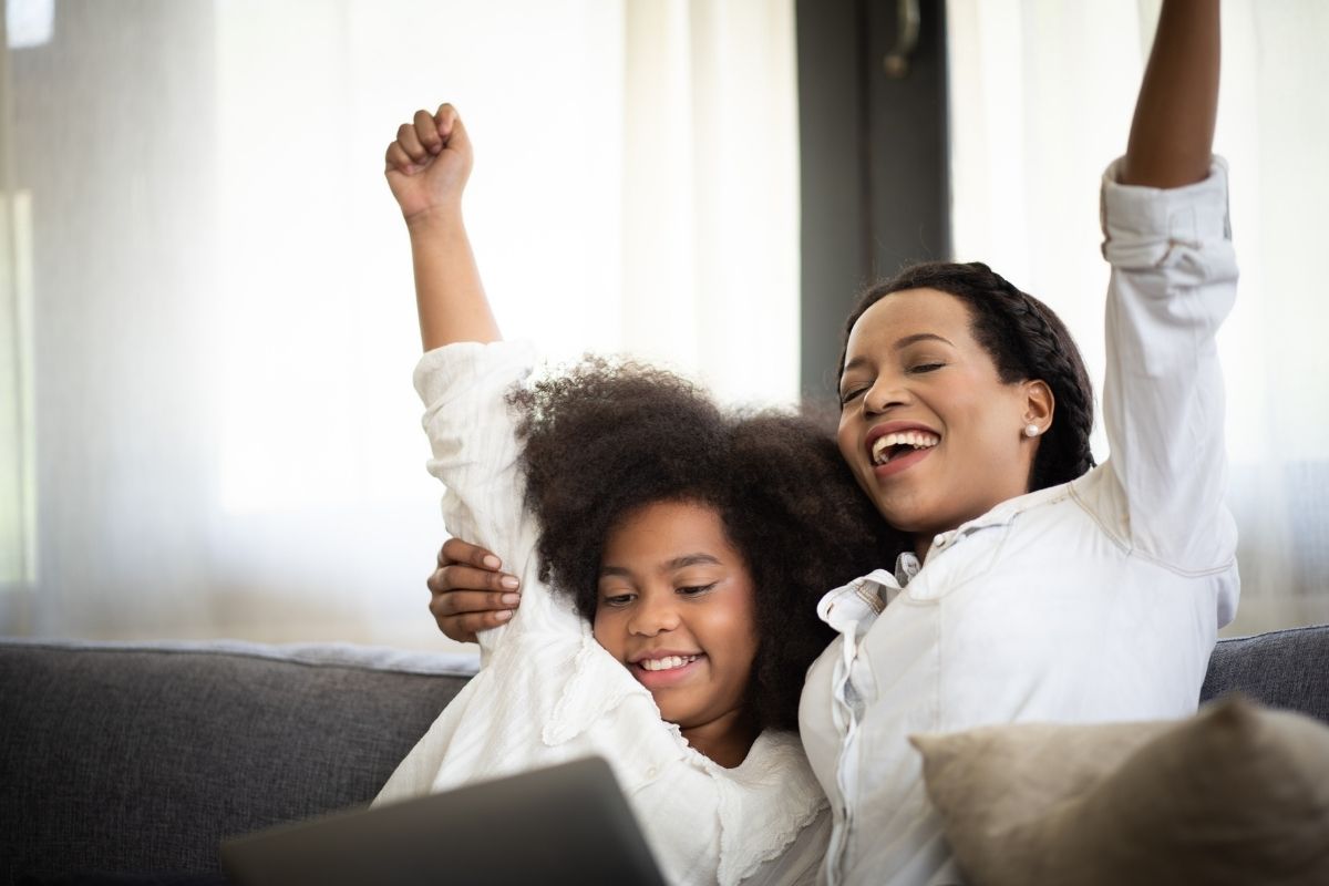 Woman and girl cheering
