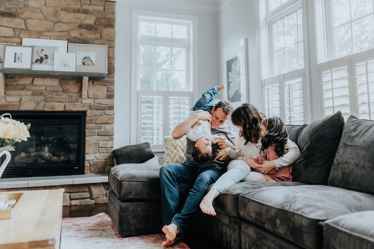 Family playing together on a couch