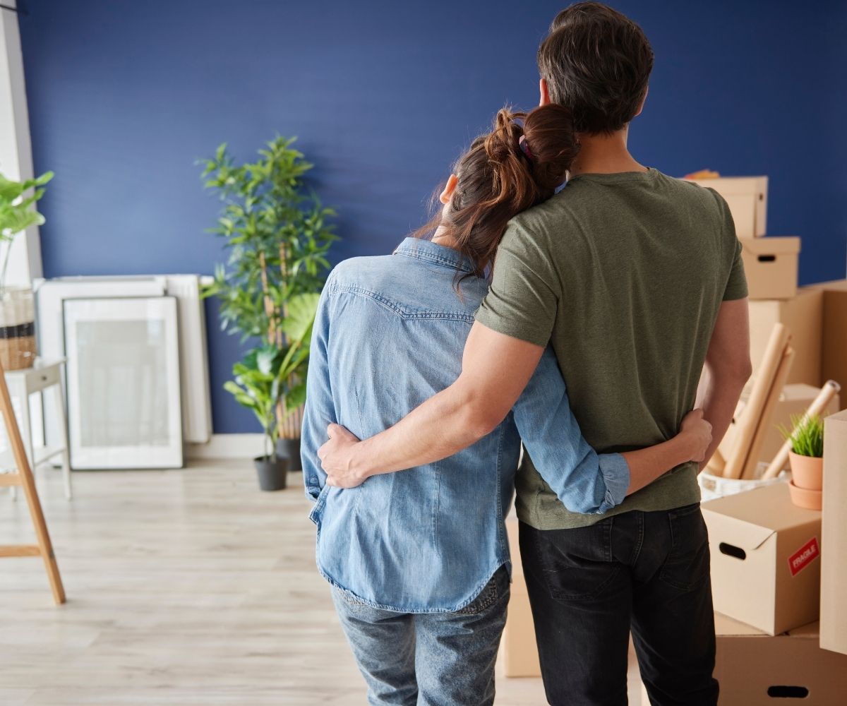 Man and woman admiring new house