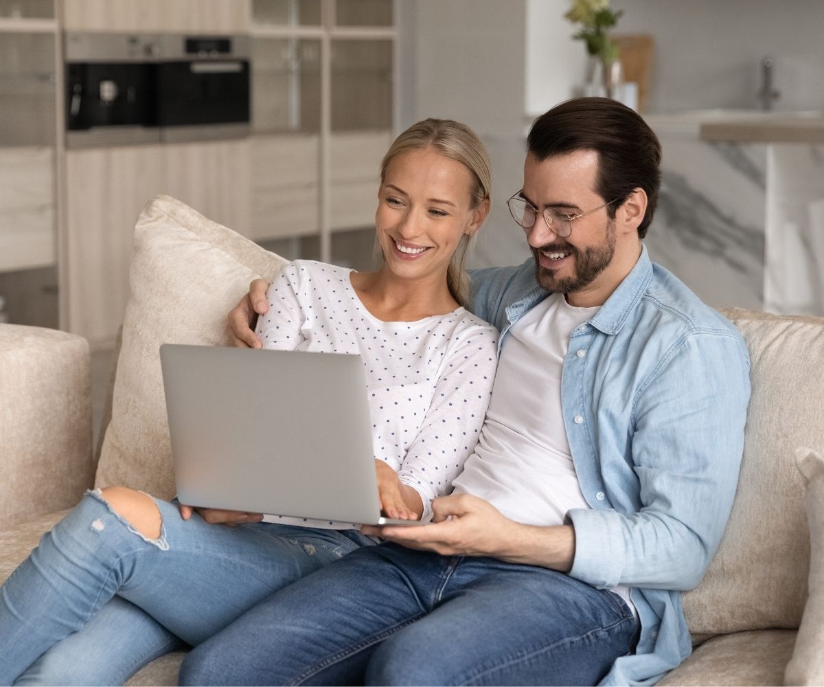 Man and woman using laptop