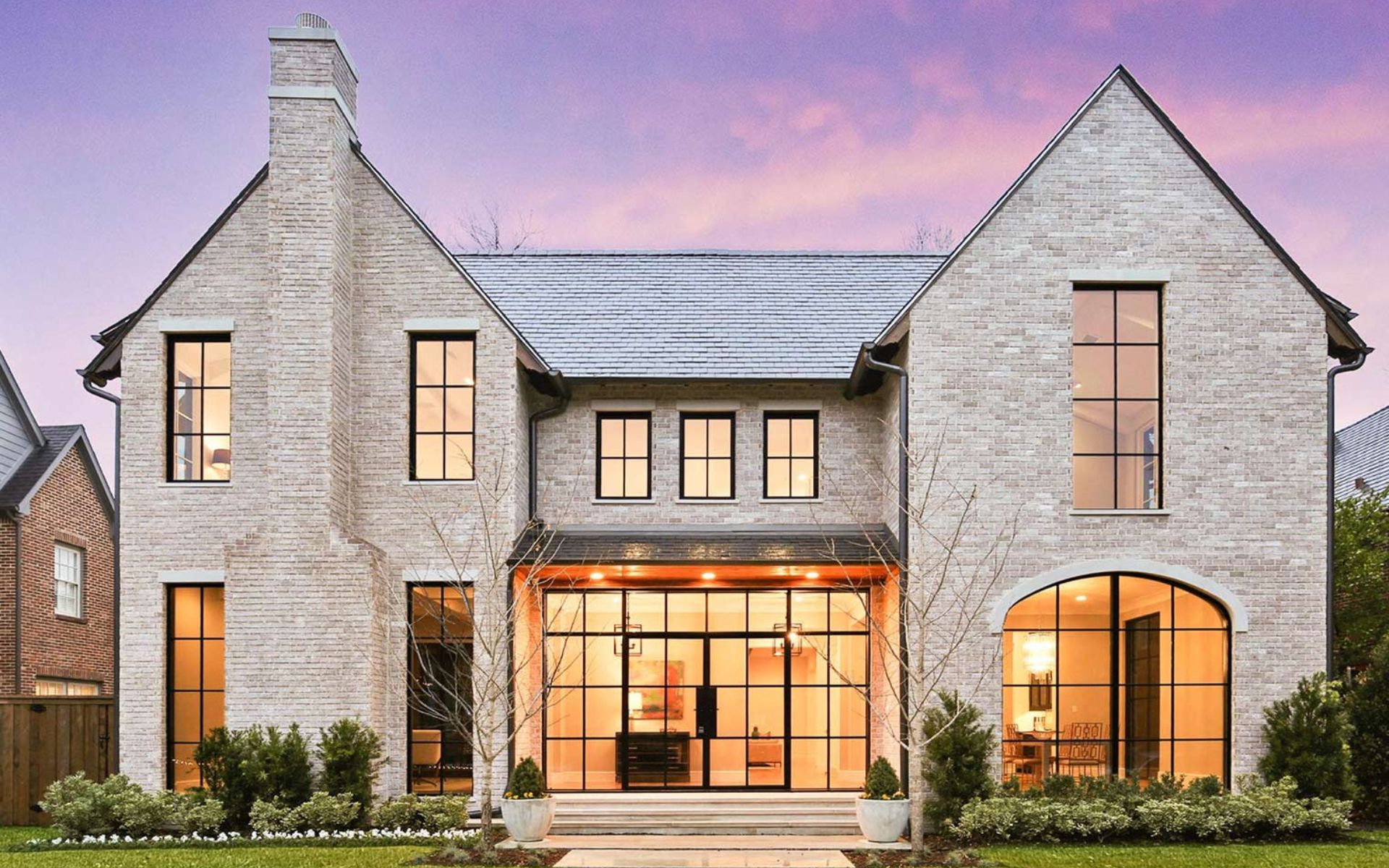 Modern stone house at dusk