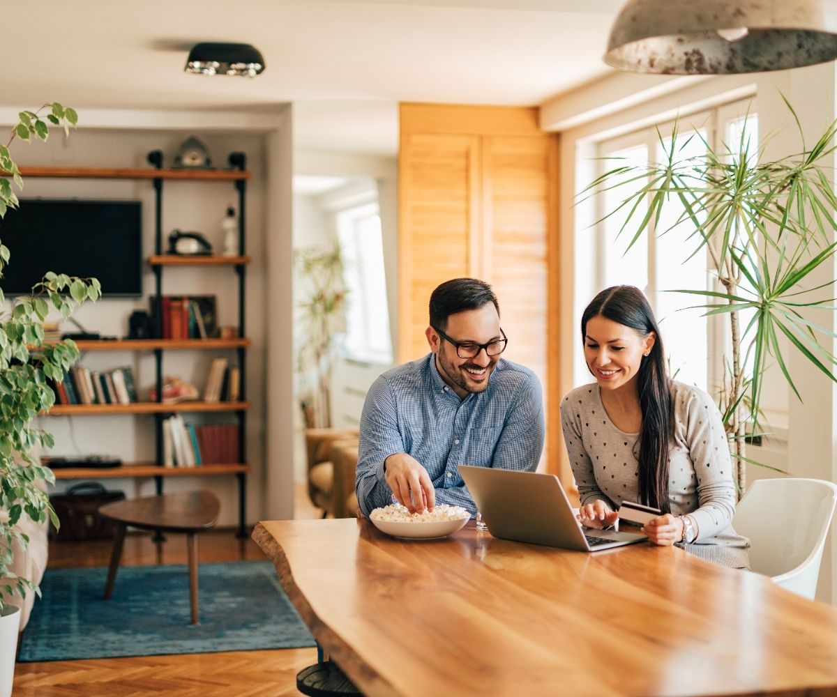 Man and woman looking at laptop